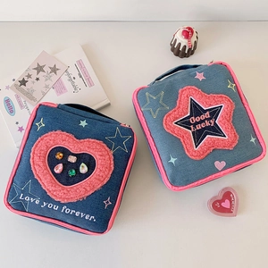 Large denim makeup bag with pink heart and star designs for travel storage