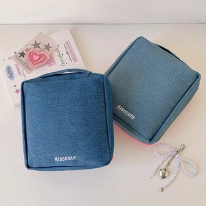 Large denim makeup bag for travel with handle and Hisocute logo in blue and navy