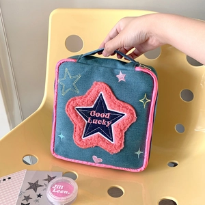 Large denim makeup bag with pink star patch and Good Lucky text for travel storage