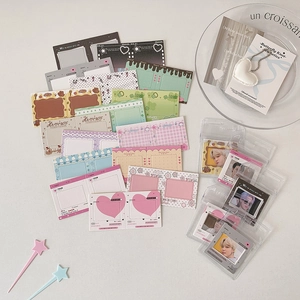 Detailed flat lay of colorful film-style photo card holders and decorative cards
