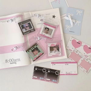 Macro detail of transparent PVC card holder with clip and decorative idol photocard stickers