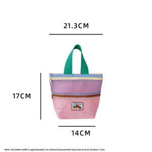 Mesh handbag dimensions 21.3x17x14cm with pink purple blue panels and green handle
