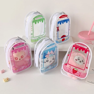 Detail of colorful transparent PVC display bags with cute cartoon patterns and plush charms