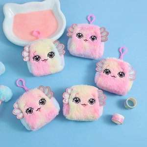 Macro view of plush cartoon coin purses with gradient fur, wings and smiling face details