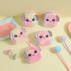 Flat lay of colorful rainbow plush monster coin purses with cute eyes and hanging hooks