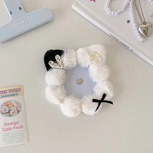 Detail of 58mm cat ear plush badge holder with pearls, ribbons, and resin roses