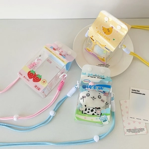 Detailed view of three cute cartoon milk box shaped cross-body bags in strawberry and banana