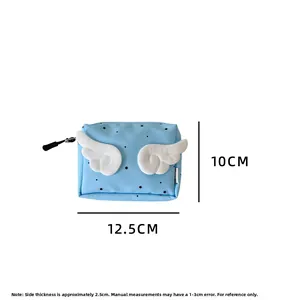 Detailed size view of blue makeup pouch with plush wings, 12.5cm width and 10cm height