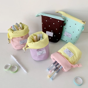 Minimalist canvas pencil case in various pastel colors with a functional telescopic design