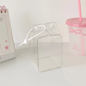 Transparent milk carton shaped doll display case with white beaded handle and minimalist style