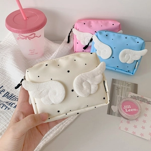 Cute angel wing cosmetic bags with star pattern in cream, pink, and sky blue colors