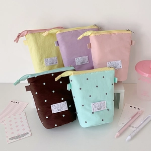 Minimalist fabric stand-up pencil case collection in multiple pastel colors and dots