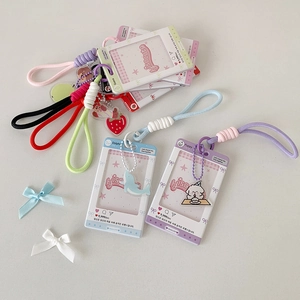 Close-up of pastel acrylic card holders with matching neck lanyards and cute charms
