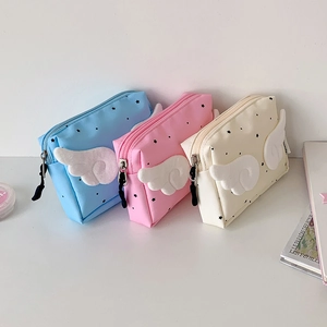 Star pattern canvas cosmetic pouch with plush wings in blue, pink, and beige