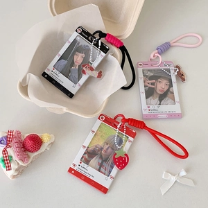 Detail of acrylic photo card holders with colorful lanyards and cute cartoon charms