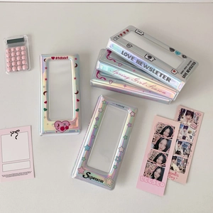 Detail of silver holographic laser photocard binder with star patterns and clear window