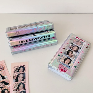 Detailed view of silver laser star photocard binder with four-grid heart design