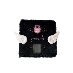 A7 plush angel wing photocard album in black with pink heart embroidery and white wings