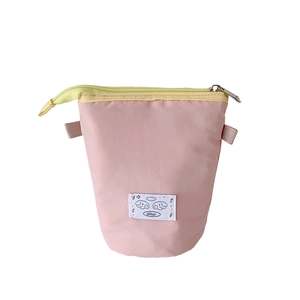 Pink fabric pencil case with yellow zipper and creative standing desktop storage design