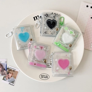 Detailed view of colorful 2-inch mini PVC albums with heart liquid sand and D-ring hooks