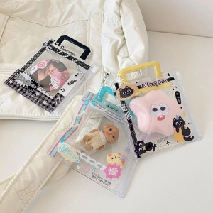 Close-up of PVC handbag-style card holders with checkerboard and rainbow patterns