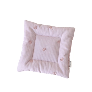 Pink quilted square coaster with striped texture and red heart embroidery for home decor