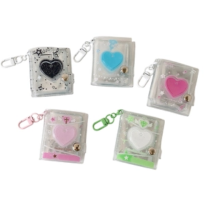 Five colorful 2-inch mini PVC photo albums with heart cutouts and keychain clips
