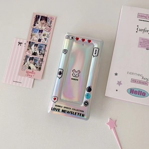 Detailed macro shot of holographic silver photocard album with pixel art graphics