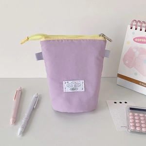 Detailed view of large capacity canvas pencil case with cute cloud patch and yellow zipper