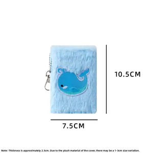 Mini plush notebook with whale embroidery and metal keychain loop, 10.5x7.5cm detail view