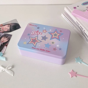 Detail of purple gradient tin box with Star print on a white decorative desk