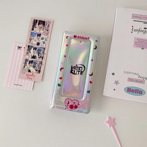 Detail of silver laser holographic card album featuring heart and star patterns