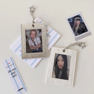 Detail of star-patterned leather photocard holders with star-shaped metal clips