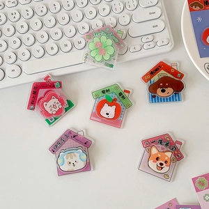 Cute acrylic cartoon animal phone sockets featuring cat and dog designs for desks