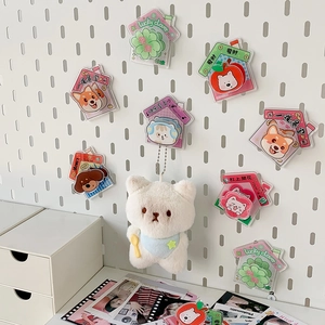 Cute cartoon acrylic magnetic fridge magnets and bear plush pendant on a pegboard