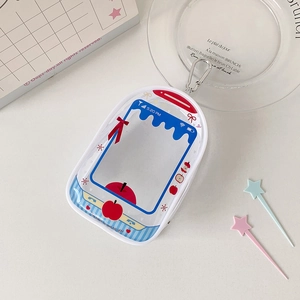 Detailed view of PVC doll display pouch with retro phone design and metal carabiner