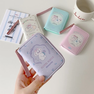 Detailed view of the litchi pattern PU leather texture and golden zipper of the coin purse