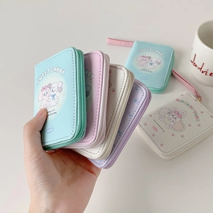 Close-up of pastel PU leather coin purses with cute animal prints and wrist straps