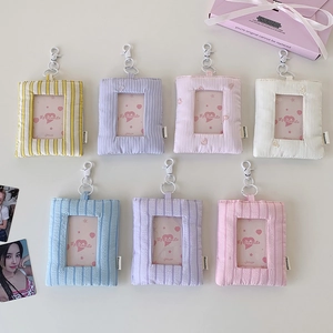 Detailed flat lay of colorful 3-inch plush card holders with heart embroidery and hooks
