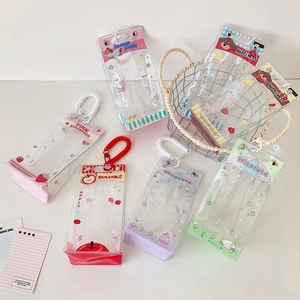 Detailed view of colorful transparent PVC display bags with strawberry patterns and handles