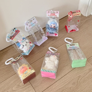 Detailed view of clear PVC doll display bags with colorful trims and hanging straps