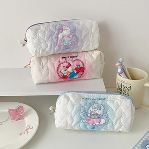 Three heart-quilted large capacity pencil pouches in pink, blue and purple with rabbit print