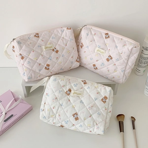 Quilted cotton makeup bags with cute bear and floral patterns for travel storage