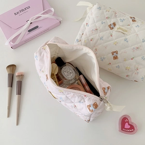 Quilted cotton cartoon bear makeup bags in pink and white with cute ribbon zipper details