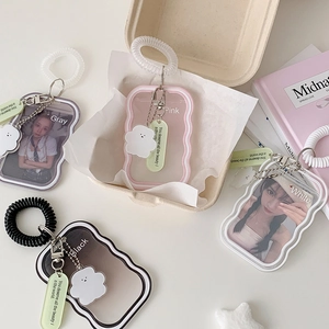 Close-up of wavy acrylic card holders with elastic spring ropes and cloud charms