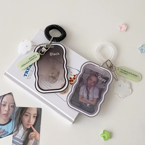 Detail of wavy wave edge card holders with spiral wristbands and decorative cloud charms