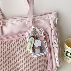 Cute transparent wavy card holder with white spring lanyard and cloud charm on pink bag