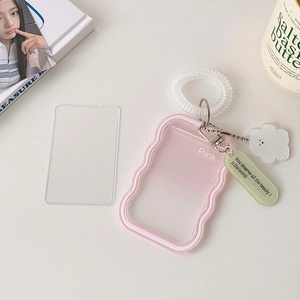 Detailed view of pink gradient silicone card holder with cloud charm and spiral wristlet