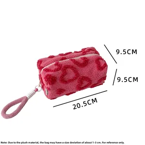 Pink plush makeup bag with embossed heart pattern showing dimensions 20.5x9.5x9.5cm