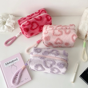 Plush heart-embossed stationery bags with wrist straps in pink purple and rose colors